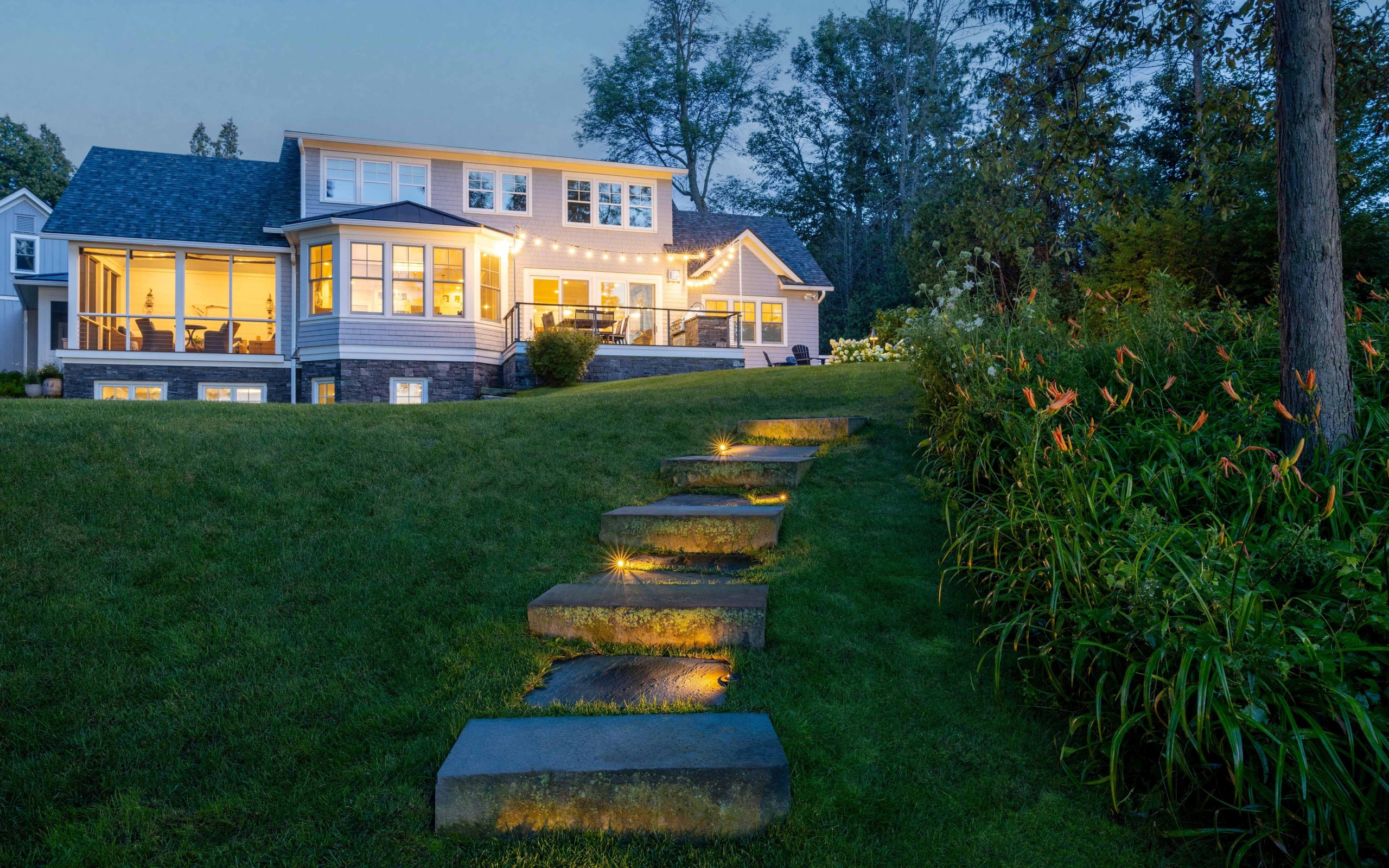 home with landscape lighting